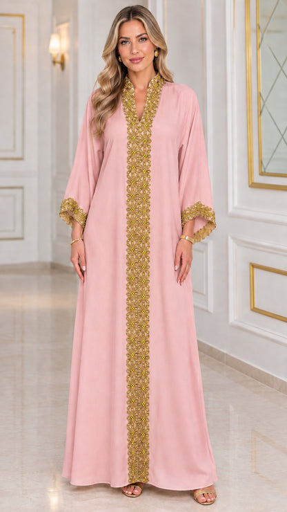 Front view of blush pink kaftan maxi dress with gold embellished trim
