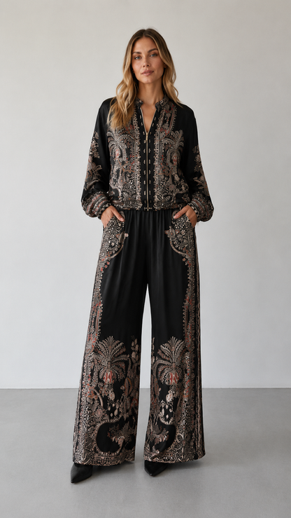 Front view of black paisley print matching set with zip-front top and full-length pants