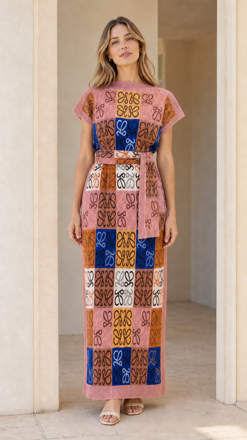 Model wearing geometric jacquard knit column maxi dress in Pink Multi