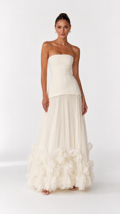 Front view of ivory strapless gown with sculpted bodice and soft pleated skirt