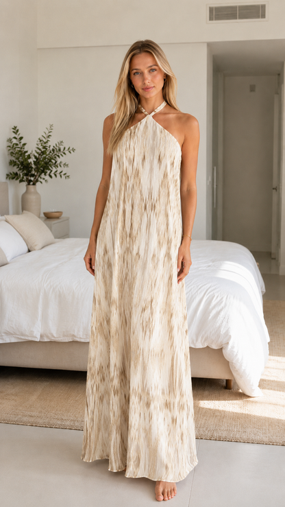 Front view of cream abstract print halter maxi dress