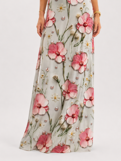 Close-up of maxi skirt showing oversized pink floral print and botanical details