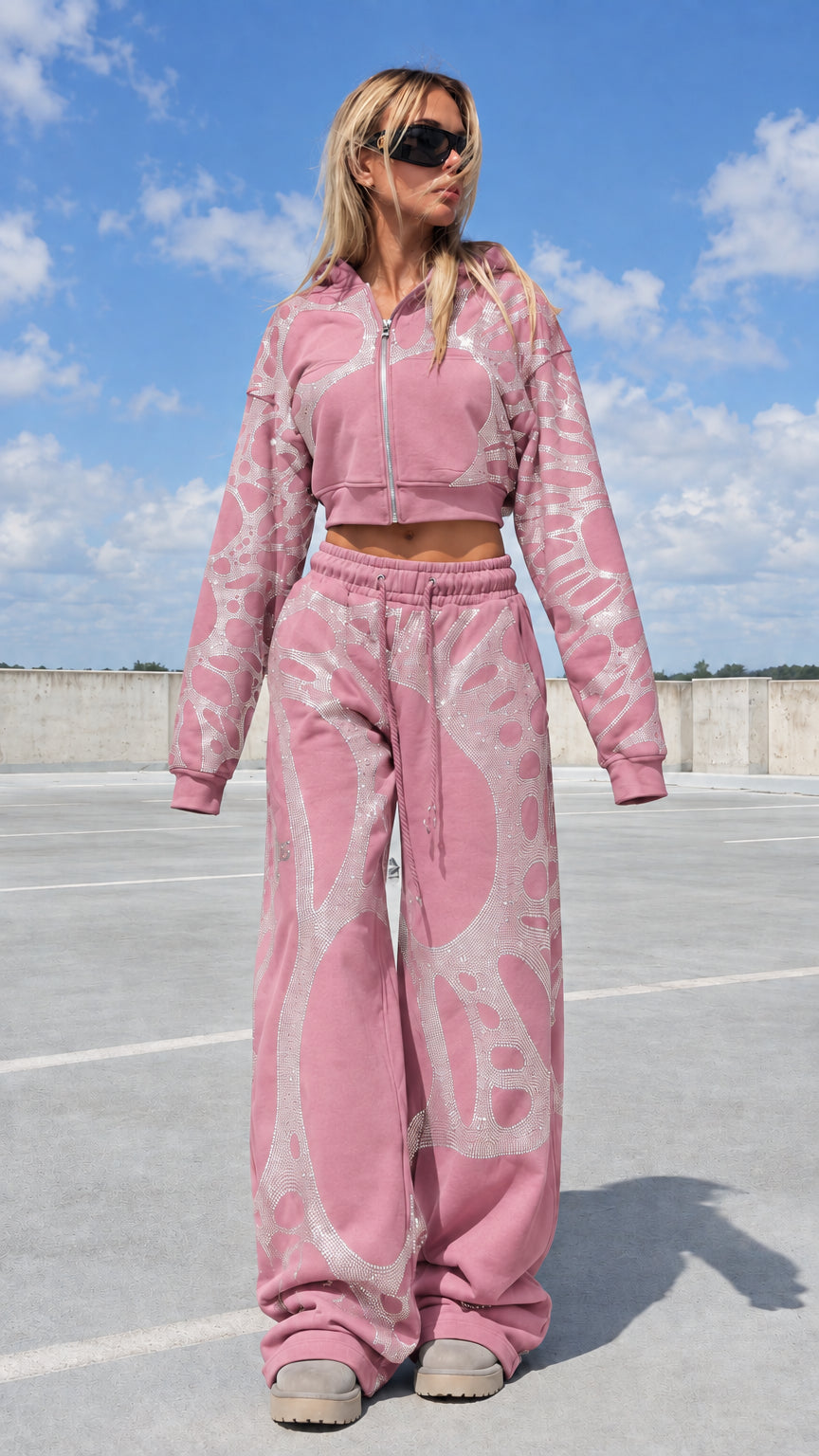 Model wearing pink rhinestone graphic cropped hoodie and sweatpants tracksuit
