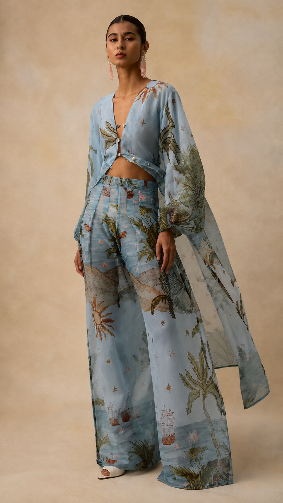 Front view of sky blue printed wide-leg pants set with sheer overlay