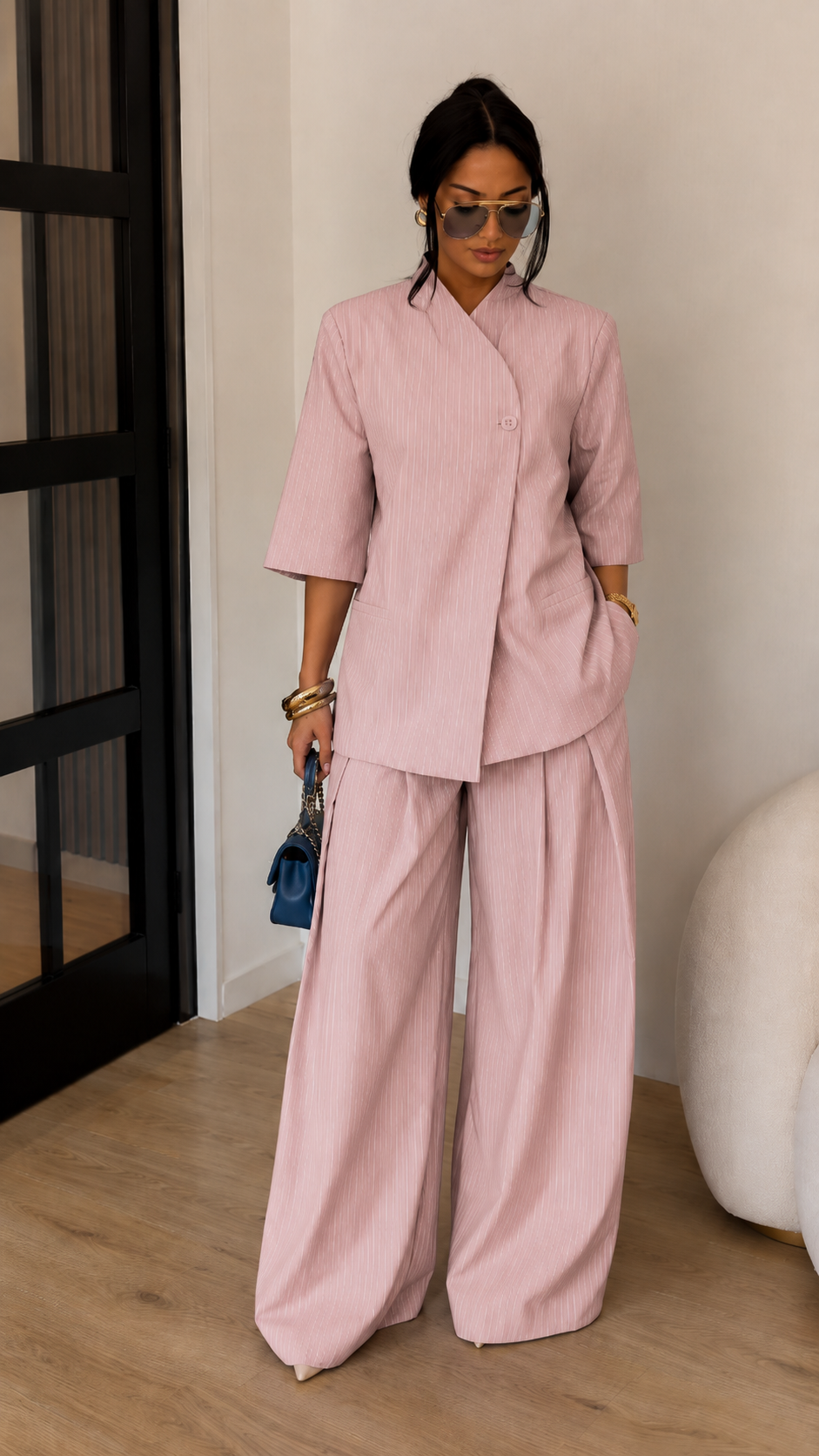 Front view of blush pink textured two-piece set with minimalist wrap-style top