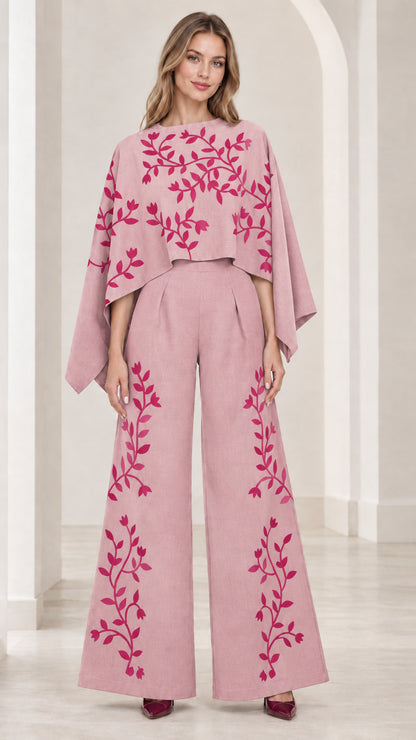 Front view of dusty pink embroidered cape sleeve wide leg jumpsuit