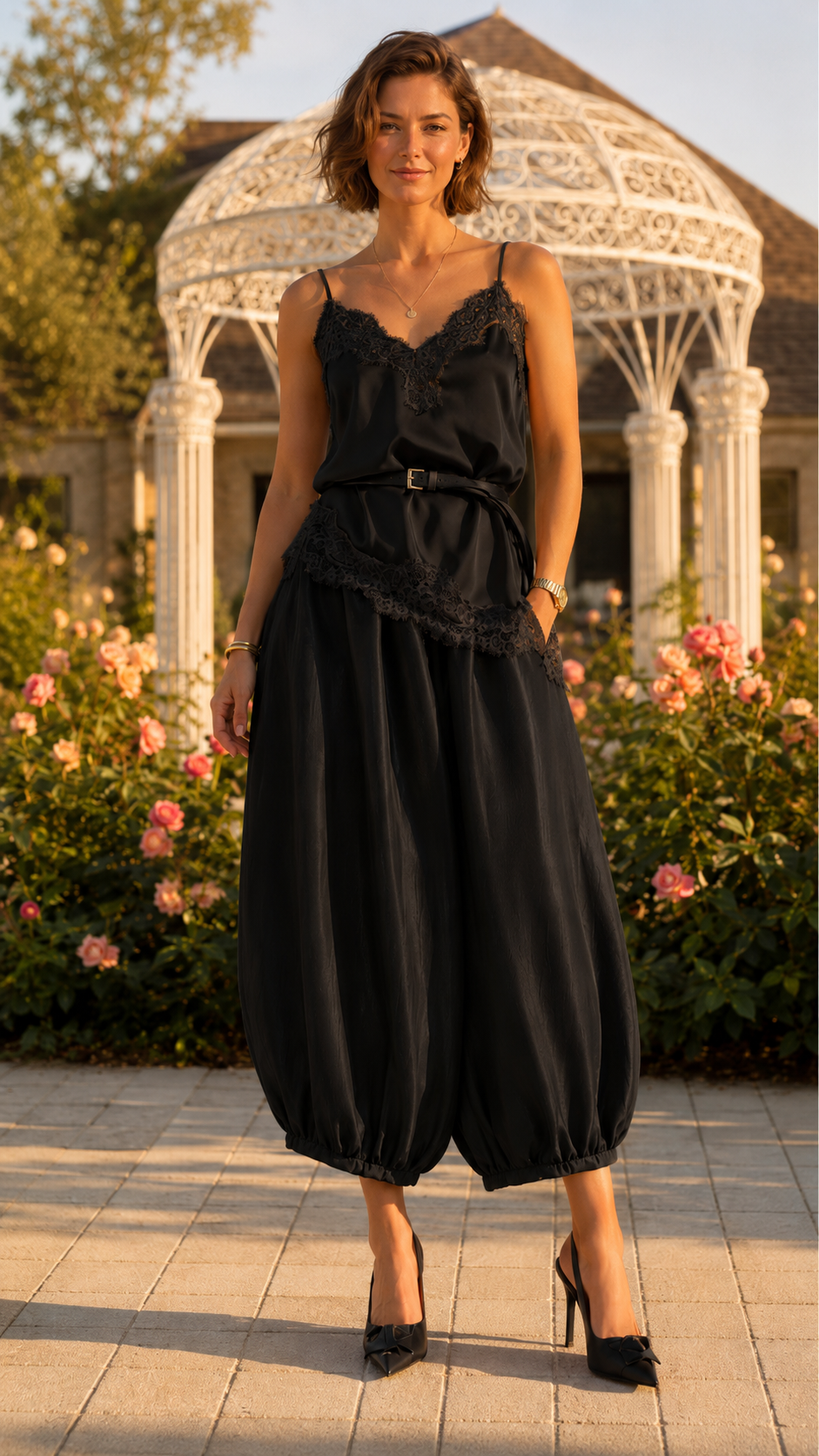 Black lace trim cami jumpsuit with belted waist and cropped full silhouette