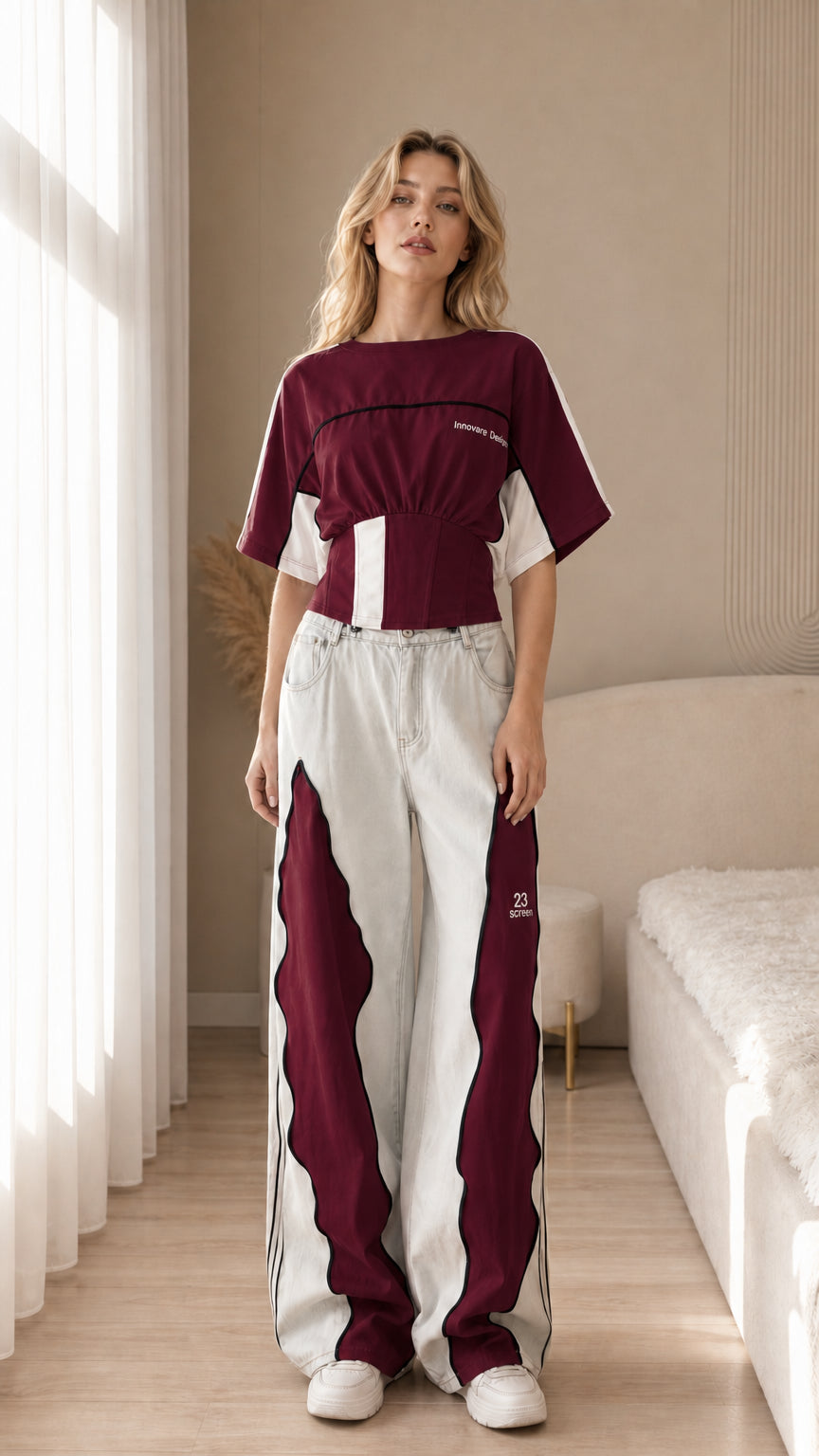 Front view of the burgundy color block cropped sport top