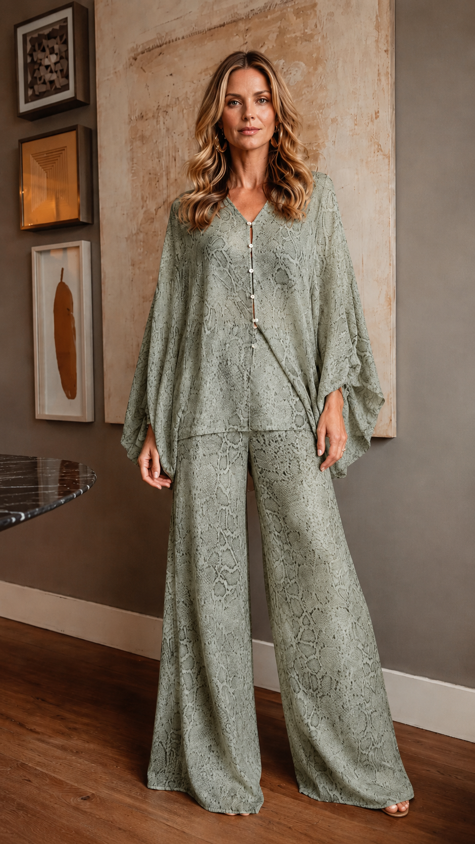 Front view of sage snake print flowing jumpsuit with V-neckline