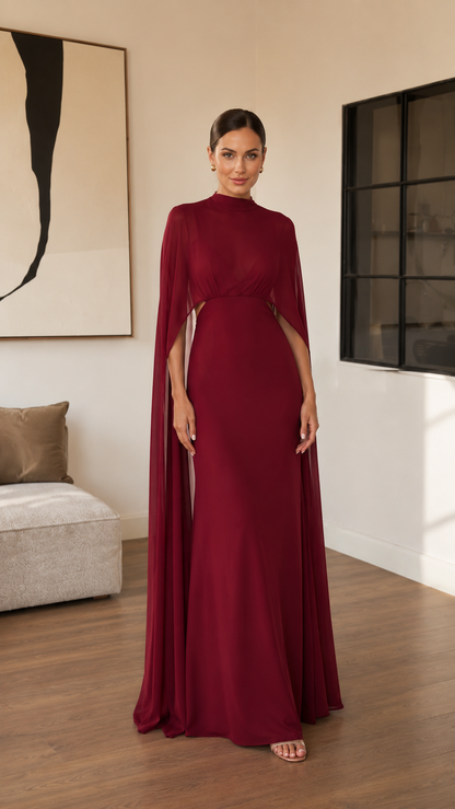 Front view of burgundy mock neck cape sleeve maxi evening gown