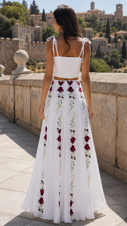 Back view of the white tie-strap crop top and embroidered maxi skirt set