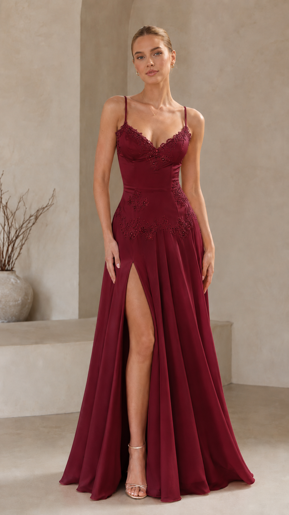 Front view of burgundy lace trim formal dress with high slit