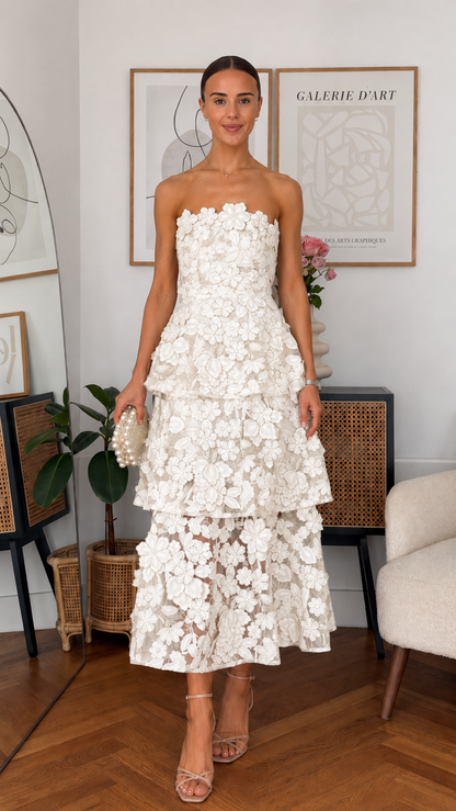Front view of white strapless 3D floral tiered midi dress