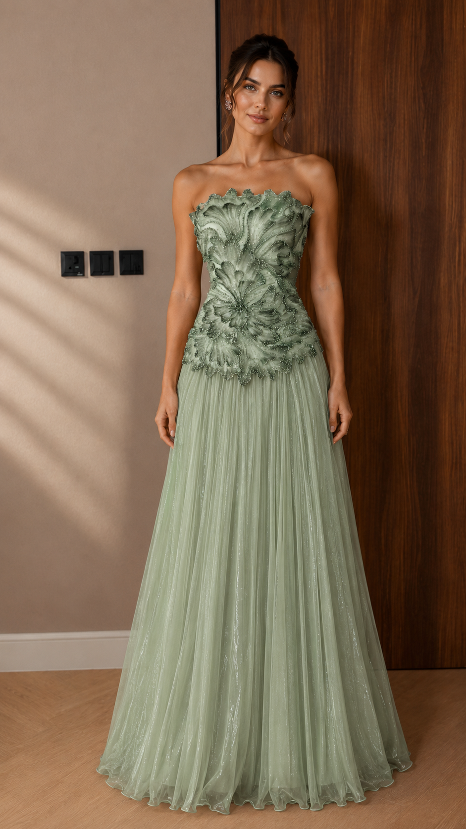 Front view of sage green strapless appliqué maxi gown with airy tulle skirt