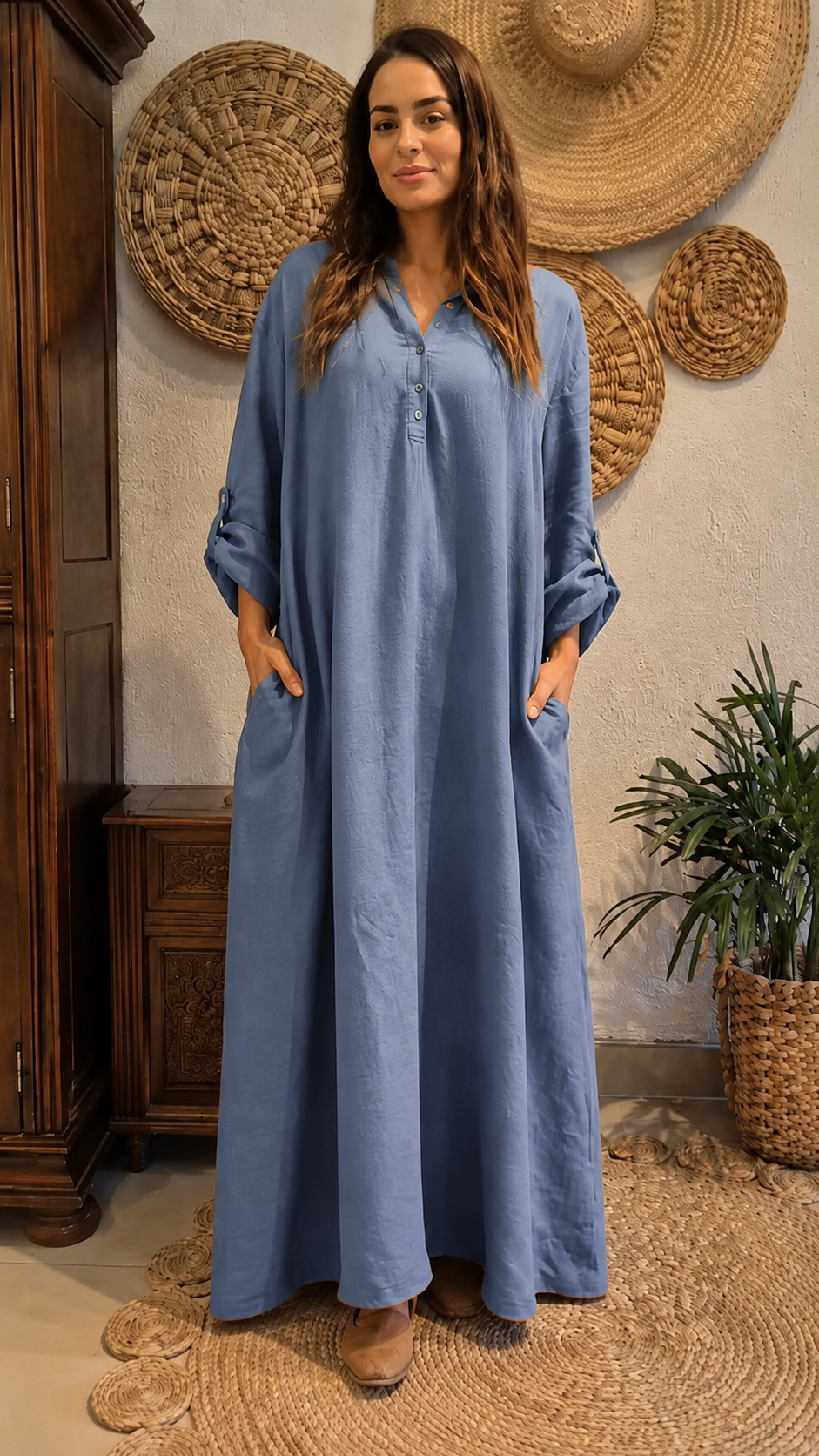 Front view of dusty blue maxi kaftan dress with button placket and pockets