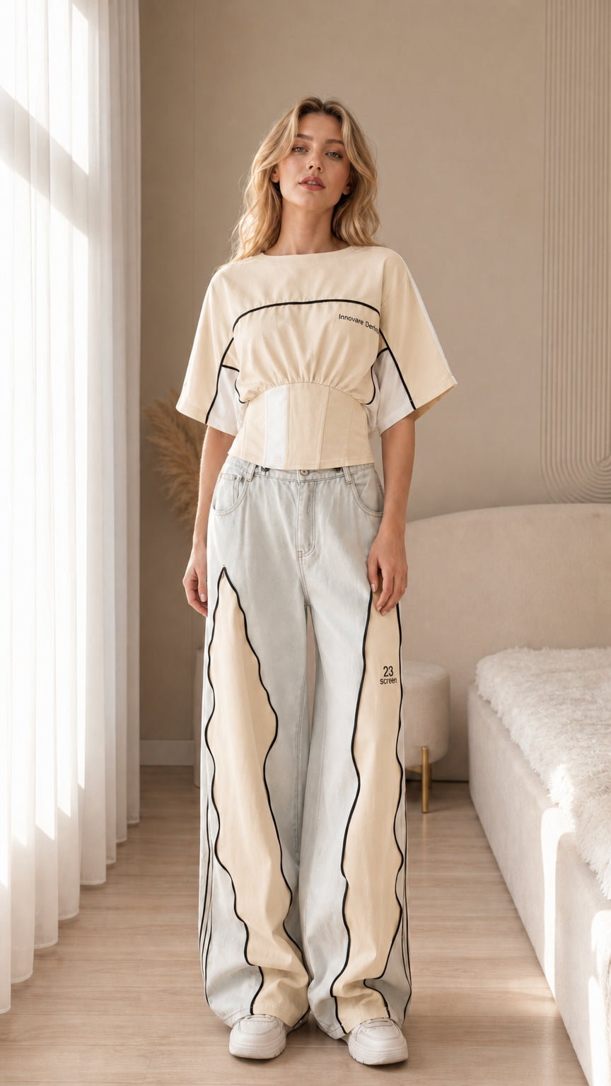 Front view of the cream color block cropped sport top