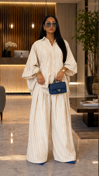 Front view of cream striped oversized shirt and wide leg pants set