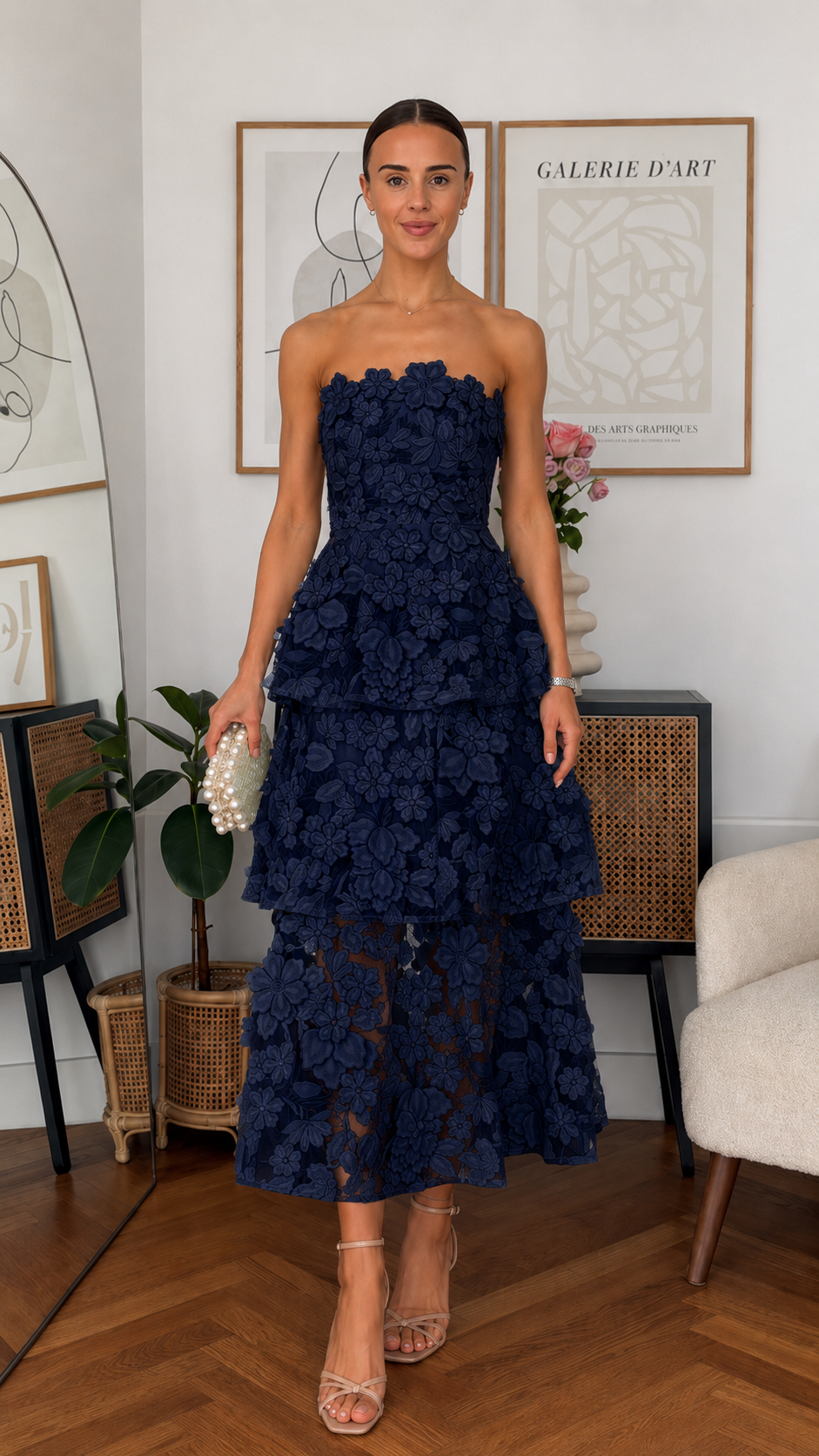 Front view of navy strapless 3D floral tiered midi dress